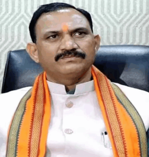 "Health Minister Shyam Bihari Jaiswal reviews a letter submitted by Pharmacy Council members Dr.